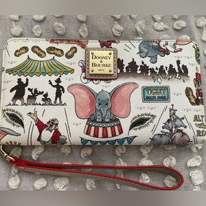Brand new Disney Dooney and Burke Dumbo wristlet AND magic band set